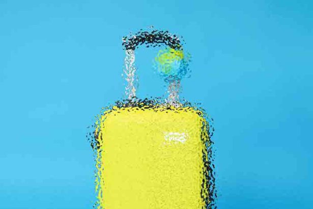 Yellow bottle with a white pump on a bright blue background, accompanied by two white-and-black capsules.