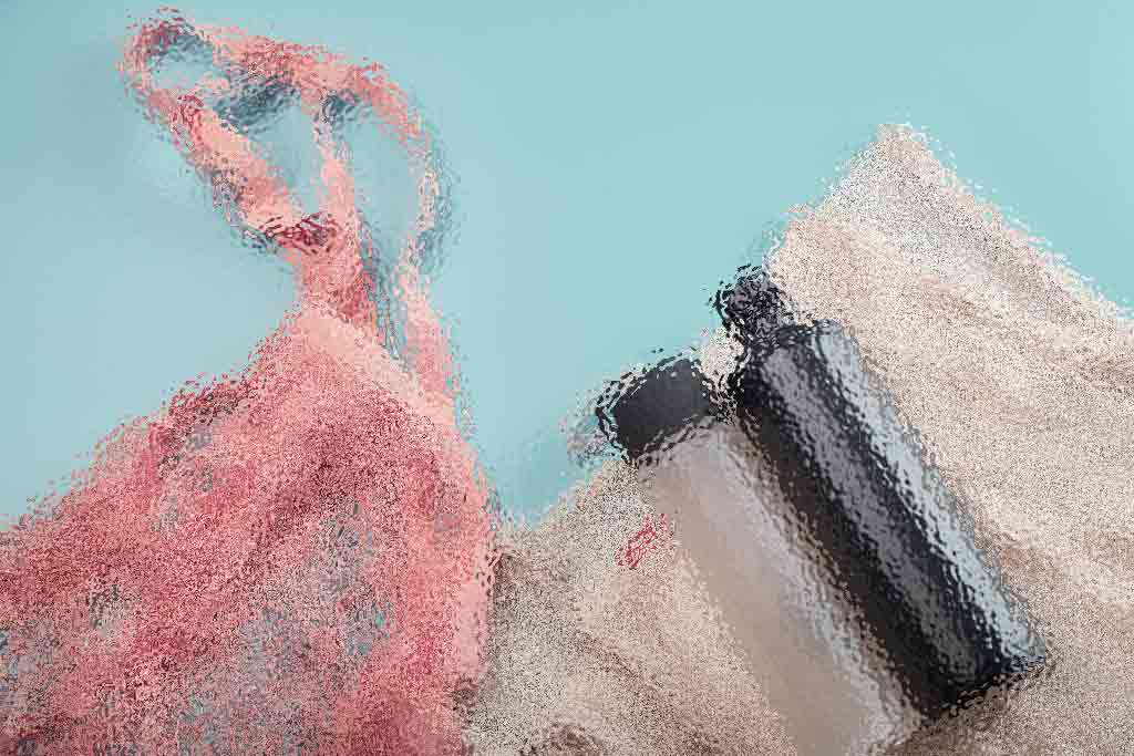 Distorted photo of a person in a pink dress against a light blue background.