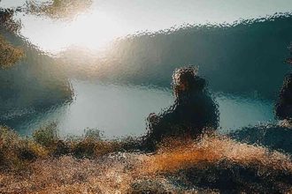 Silhouette of a person sitting near a rocky pool, viewed through rippled water with bright sunlight above left edge.