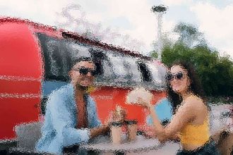 Two people wearing sunglasses pose by a red inflatable boat at a sunny poolside outdoor area.