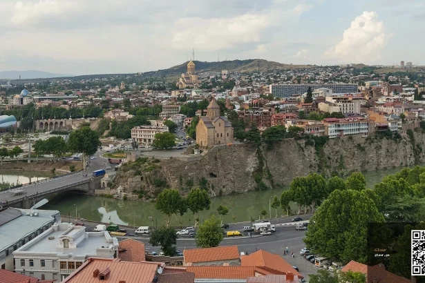 Panoramic view of Tbilisi's old town and river, a top destination for tourists in Georgia.