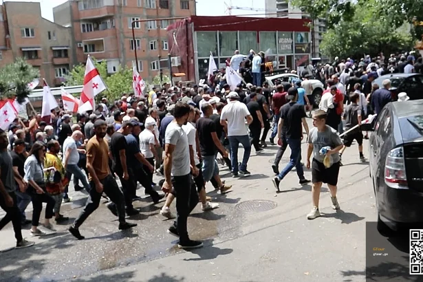 Anti-LGBT nationalist protesters march through a Tbilisi neighborhood during the 2023 Pride attack.