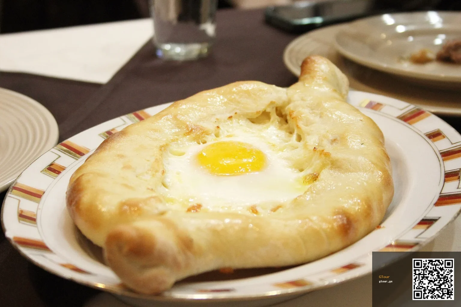 Adjaruli khachapuri, the boat-shaped bread with egg and butter, a top Tbilisi order.