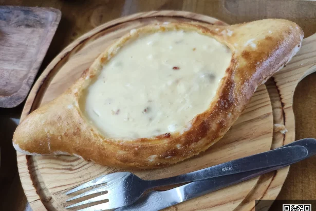 Khachapuri, Georgia's iconic cheese-filled bread, a must-try dish for Moldovan visitors.