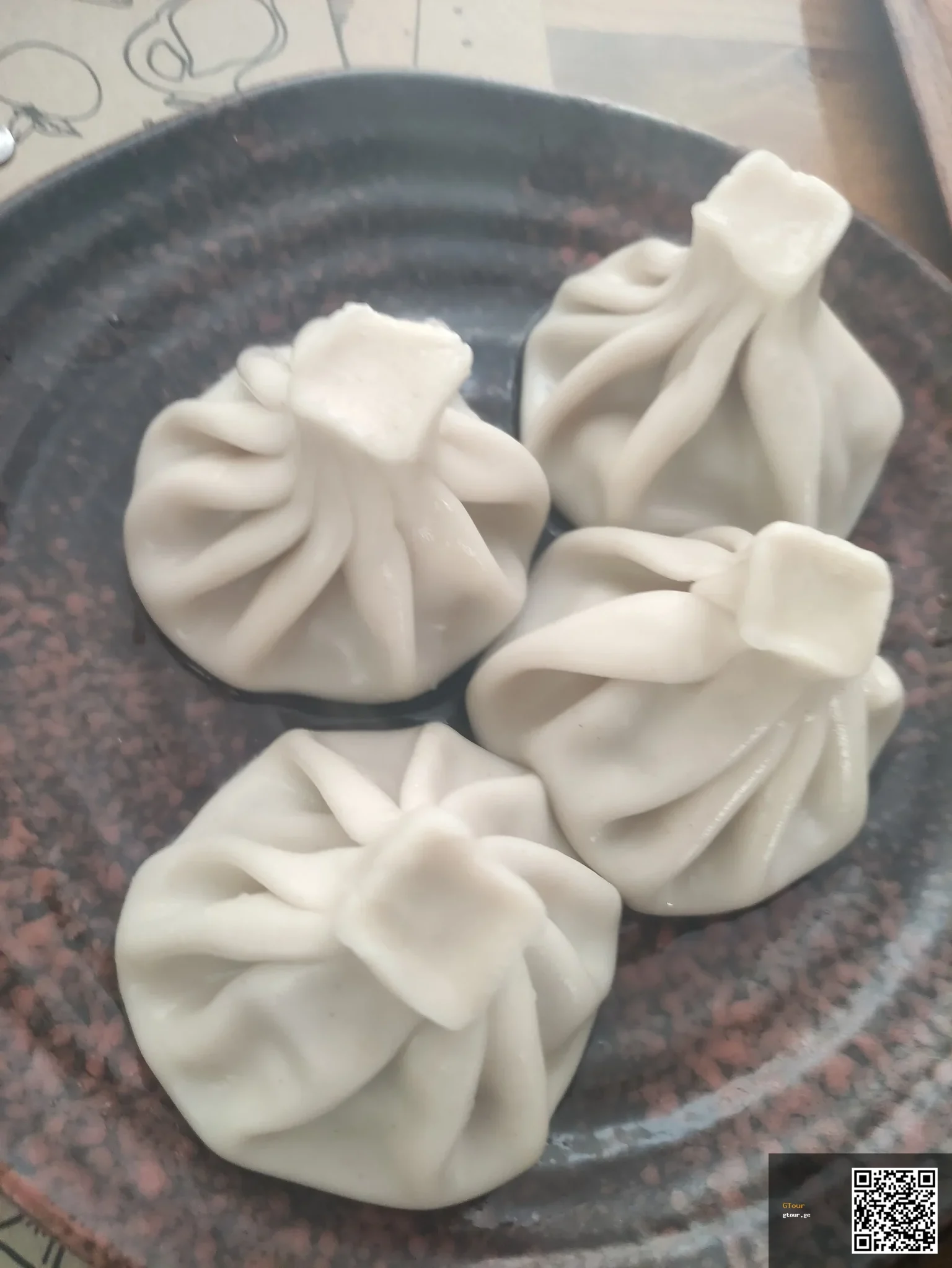 Khinkali, Georgia's iconic dumplings, a dish travellers from Liechtenstein will encounter everywhere.