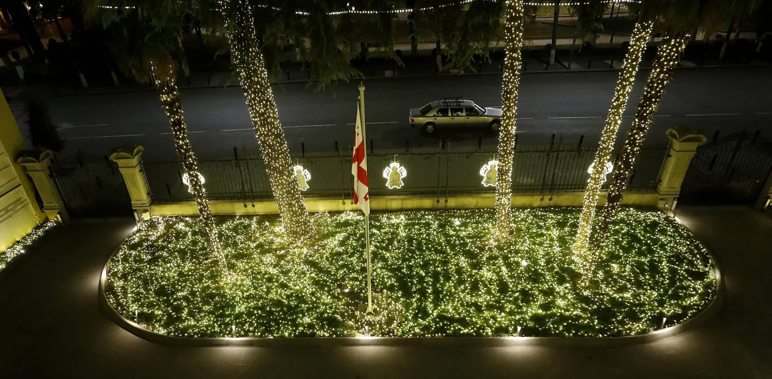 Christmas lights illuminate the front yard of Tbilisi's Orbeliani Presidential Palace in December.