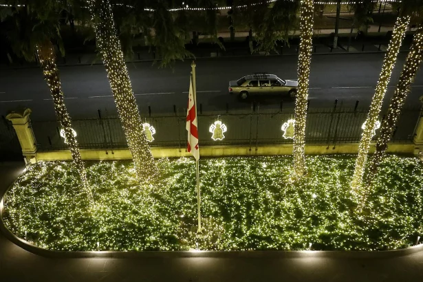 Christmas lights illuminate the front yard of Tbilisi's Orbeliani Presidential Palace in December.