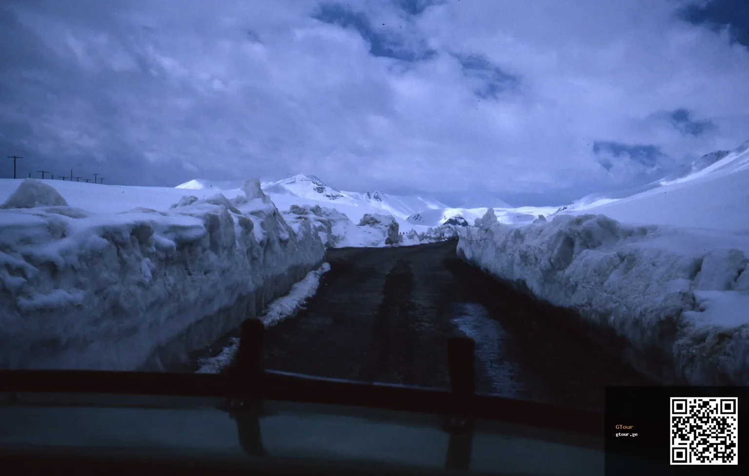 A snow-packed mountain pass illustrates the challenging winter driving conditions on Georgia's highways.