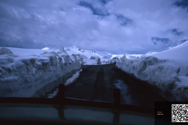 A snow-packed mountain pass illustrates the challenging winter driving conditions on Georgia's highways.
