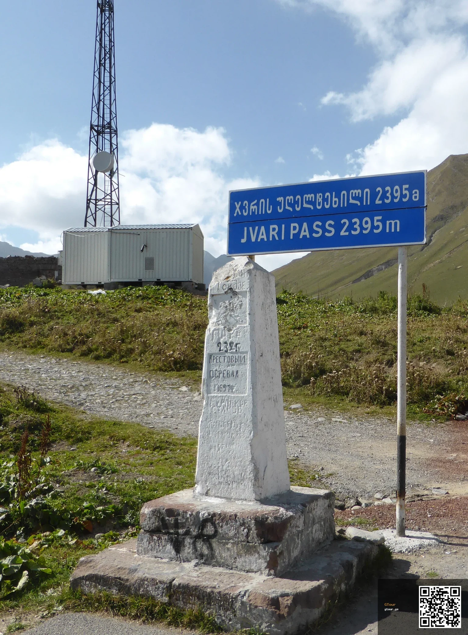Milestone marking Jvari Pass at 2,395 m on the Georgian Military Highway.
