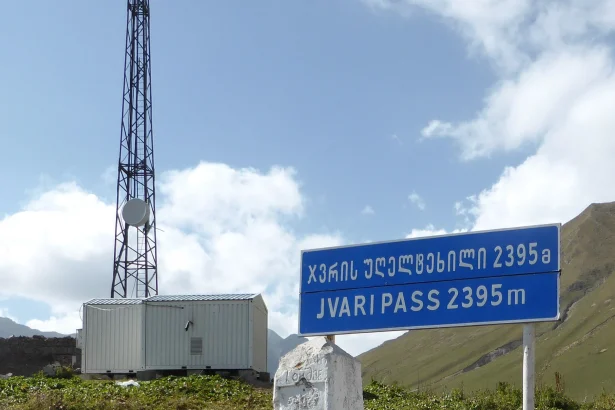 Milestone marking Jvari Pass at 2,395 m on the Georgian Military Highway.