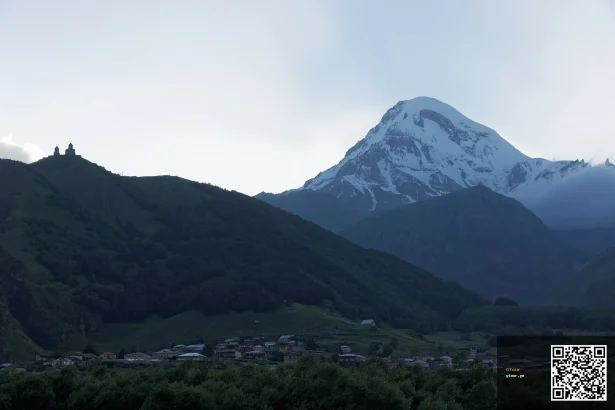 Gergeti Trinity Church beneath snow-capped Mount Kazbek, the iconic sight near Stepantsminda.