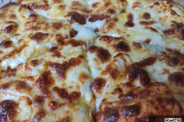Khachapuri, Georgia's iconic cheese-filled bread, a must-try dish for visitors from Mali.