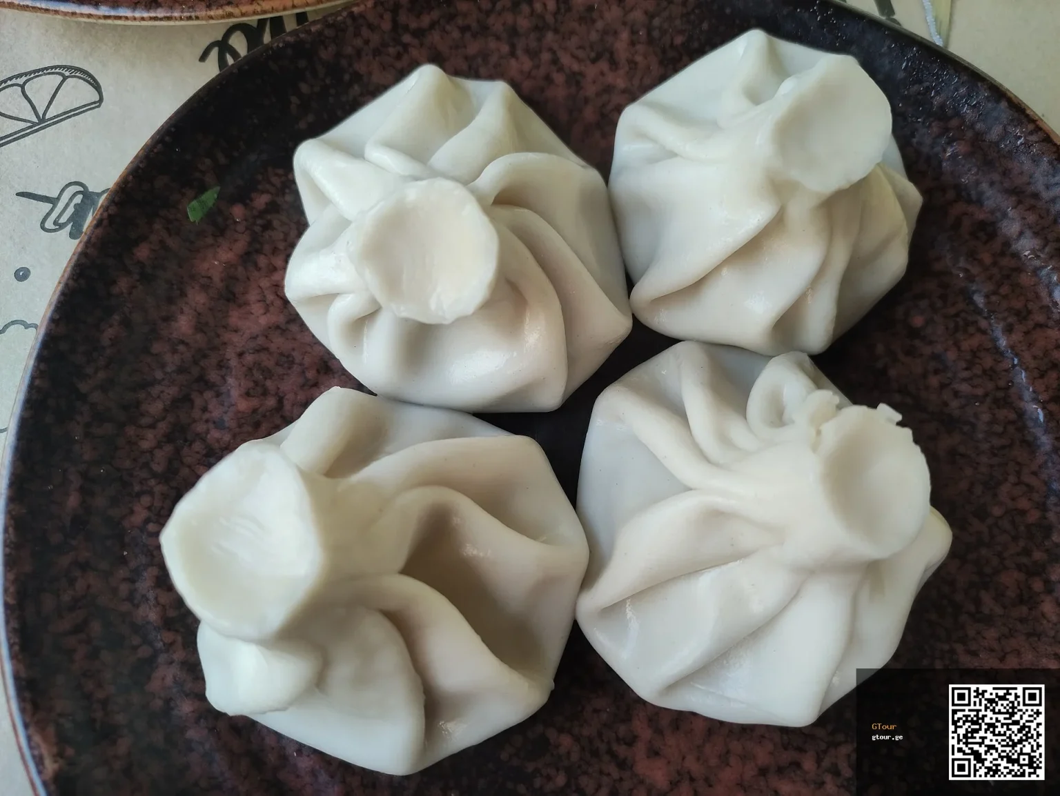 Khinkali, Georgia's iconic dumpling, a familiar comfort food for Maldivian visitors.
