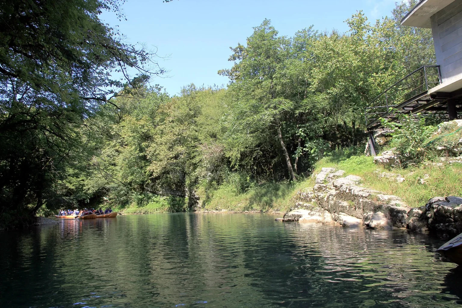 Boats carrying visitors through the Martvili canyon on the Abasha river.