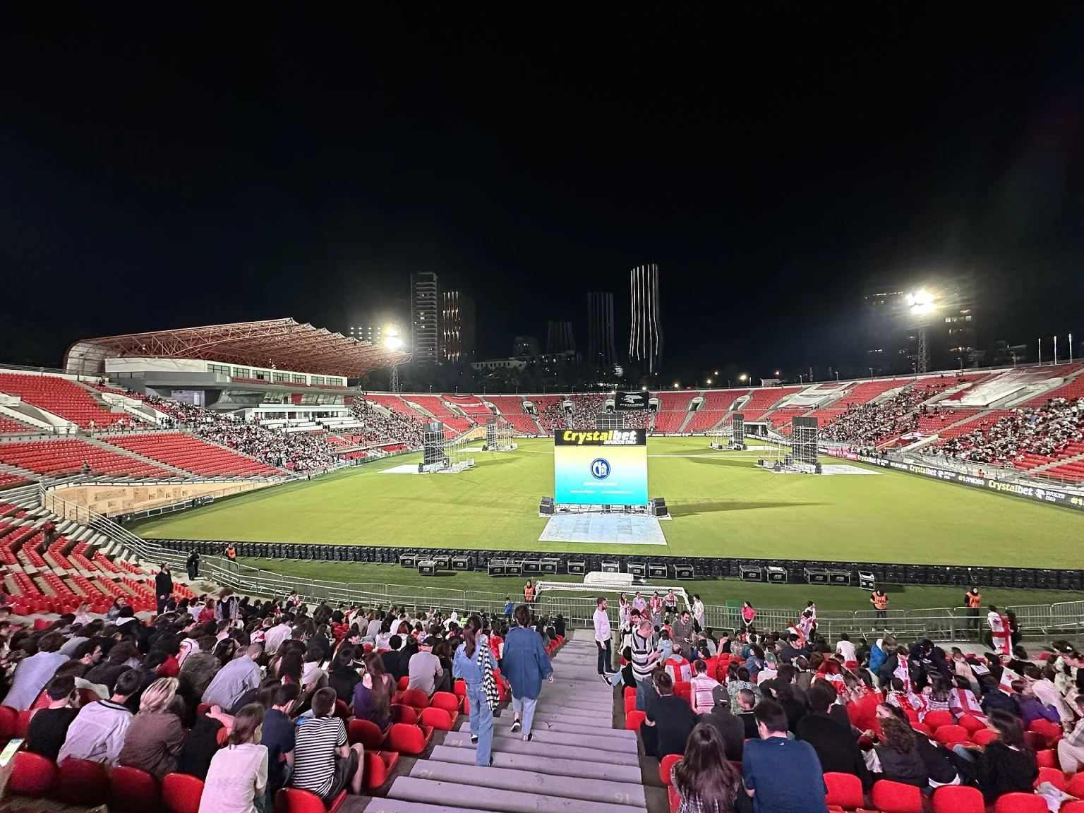 Crowd fills Mikheil Meskhi Stadium in Tbilisi for a Georgia national team football match.