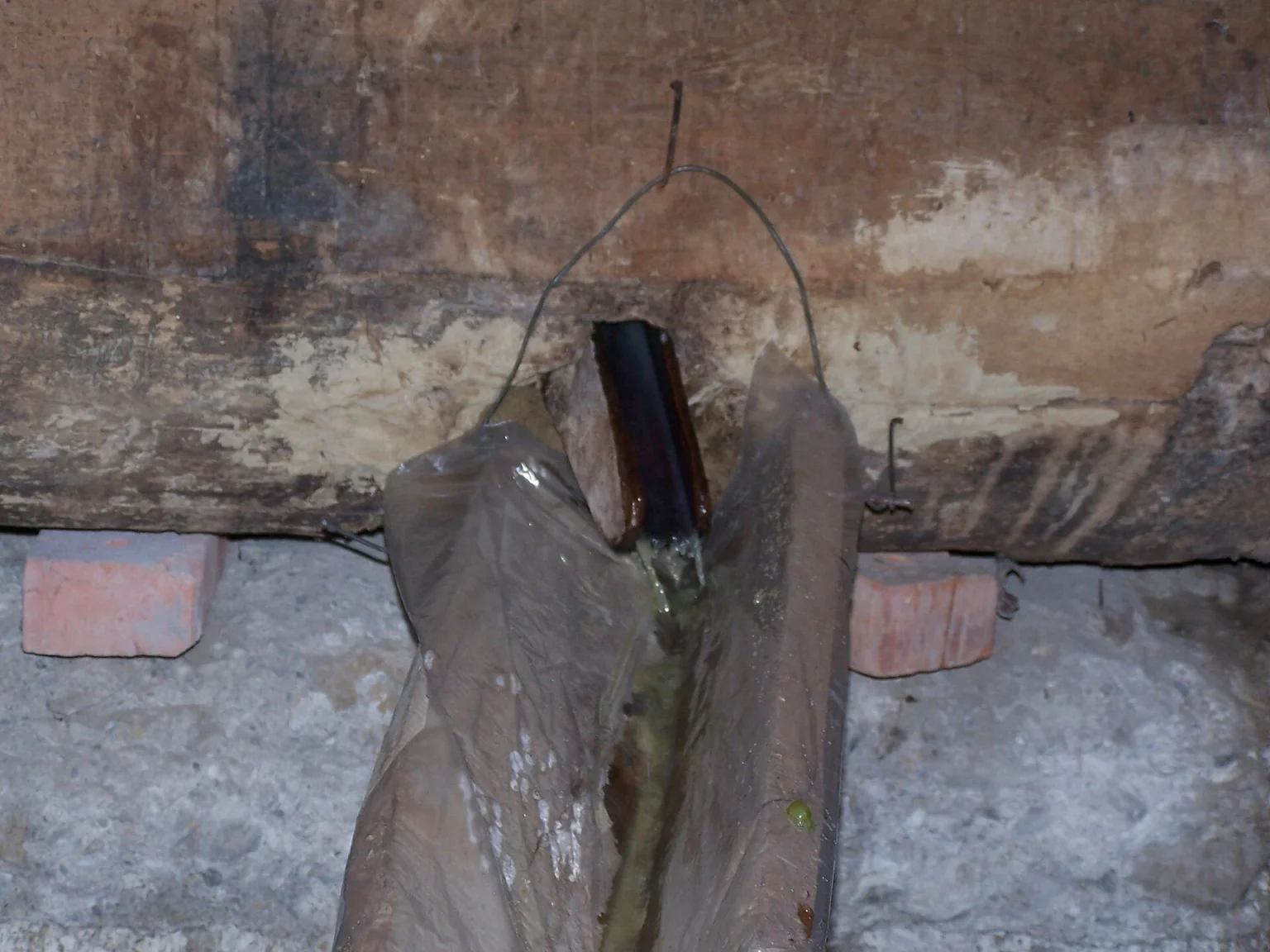 Grape must drains through a traditional cloth filter during Kakheti's autumn Rtveli wine harvest.