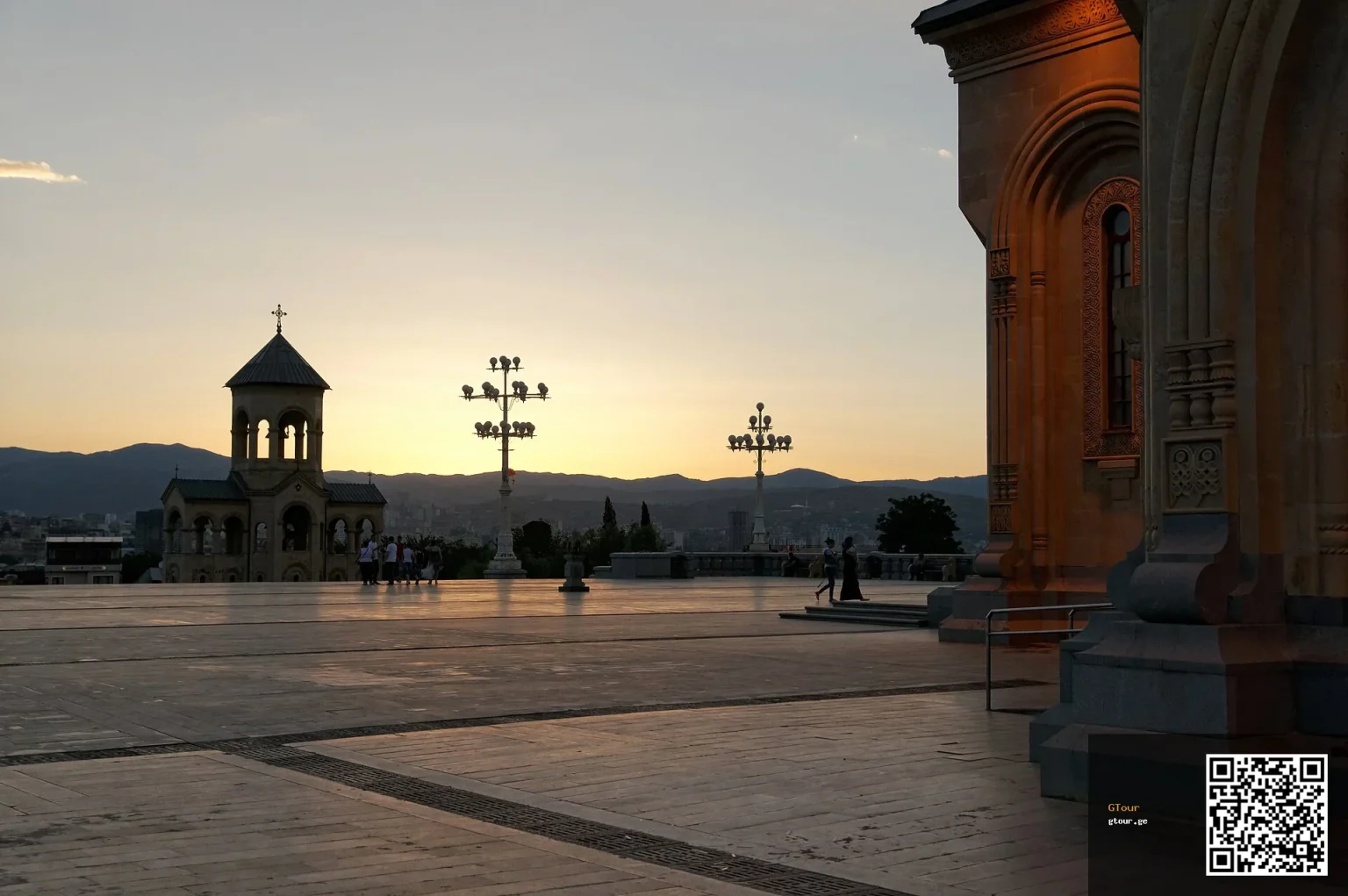 Sunset view of Tbilisi's Holy Trinity Cathedral, the city's iconic landmark for visitors.