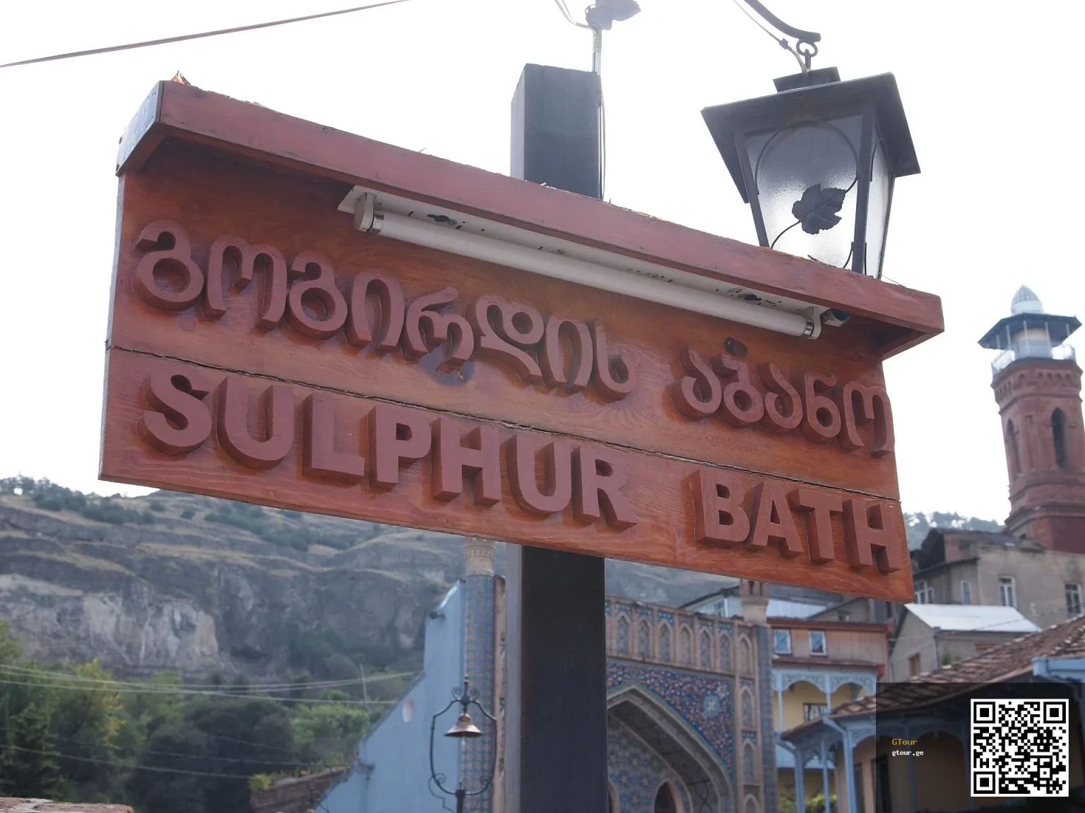 A Tbilisi sulphur bathhouse sign, a classic sight for travellers exploring the old city.