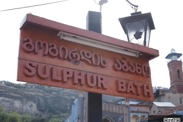 A Tbilisi sulphur bathhouse sign, a classic sight for travellers exploring the old city.