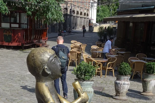 A bronze Tamada (toastmaster) statue in Tbilisi's Old Town reflects Georgia's feast and toasting culture.