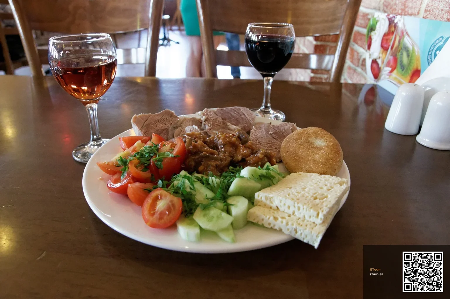 A typical restaurant meal with wine served in Tbilisi, Georgia.