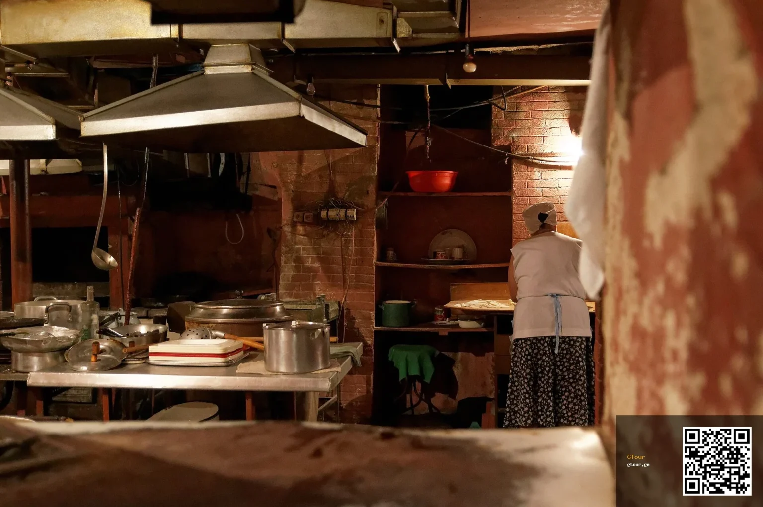 A traditional Georgian kitchen in Tbilisi, showing authentic food preparation travellers may encounter.