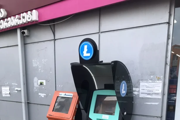 A cryptocurrency and currency exchange kiosk on a street in Batumi, Georgia.