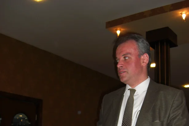 A modern-day tamada stands to deliver a toast, horn-glass in hand, at a Georgian supra.