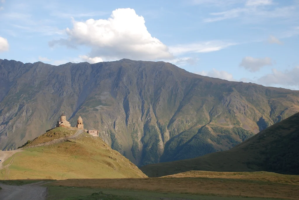 Gergeti Trinity Church beneath Mount Kazbek, a classic side trip from Tbilisi for travellers.