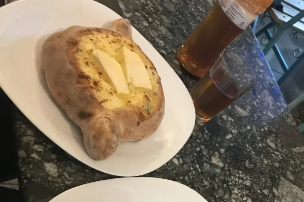Khachapuri, Georgia's iconic cheese-filled bread, a must-try dish for visitors.